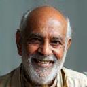 Photo of satisfied customer Suresh Kumar smiling broadly
